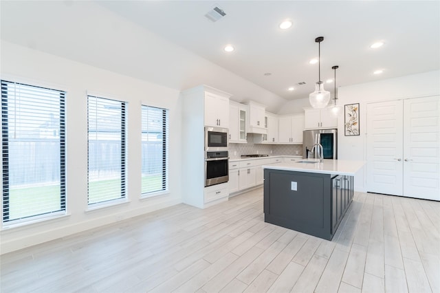 14811 Opossum Branch Ct, Cypress, TX 77433 - kitchen featuring stainless steel appliances, light countertops, white cabinets, backsplash, and recessed lighting