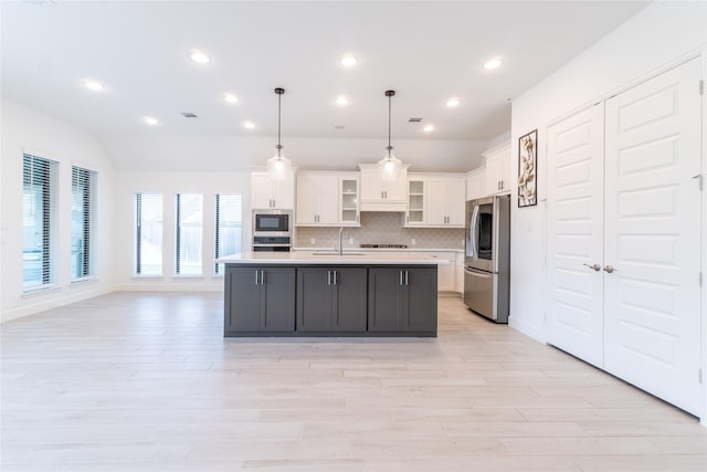 14811 Opossum Branch Ct, Cypress, TX 77433 - kitchen with appliances with stainless steel finishes, light countertops, white cabinetry, decorative backsplash, and recessed lighting