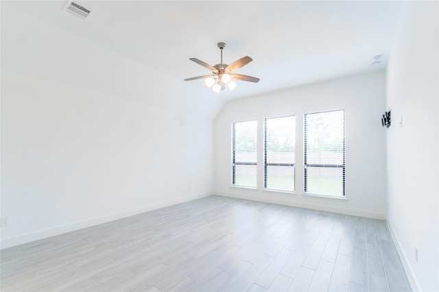 14811 Opossum Branch Ct, Cypress, TX 77433 - spare room featuring ceiling fan, light wood-type flooring, and vaulted ceiling