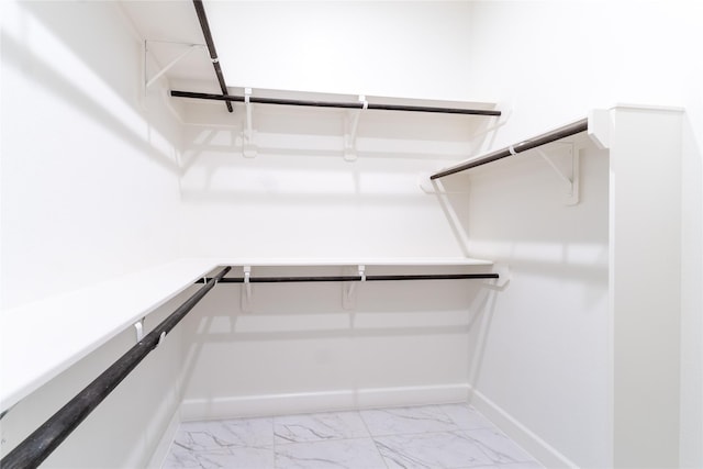 14811 Opossum Branch Ct, Cypress, TX 77433 - walk in closet featuring light marble finish floors