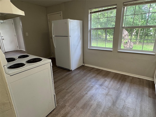2222 8th St, Houston, TX 77547 - kitchen featuring white appliances, extractor fan, plenty of natural light, and wood finished floors