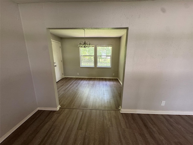 2222 8th St, Houston, TX 77547 - unfurnished dining area featuring dark wood finished floors and a chandelier