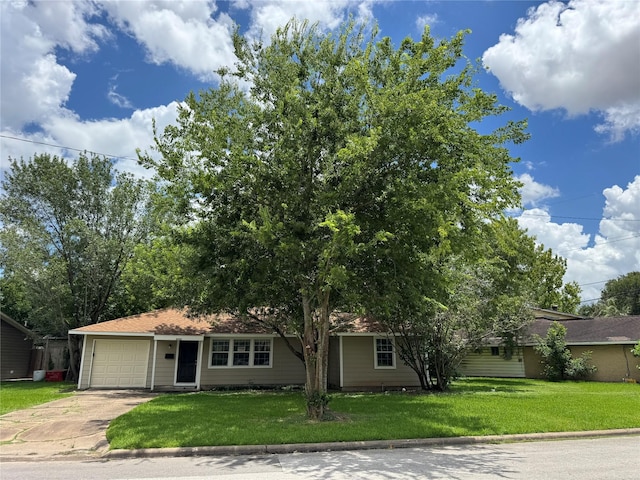 2222 8th St, Houston, TX 77547 - view of front of property with concrete driveway, a front lawn, and a garage