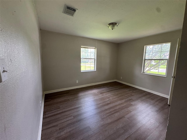 2222 8th St, Houston, TX 77547 - spare room with dark wood finished floors and baseboards