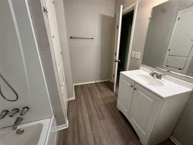 2222 8th St, Houston, TX 77547 - full bathroom with vanity, wood finished floors, and bathtub / shower combination