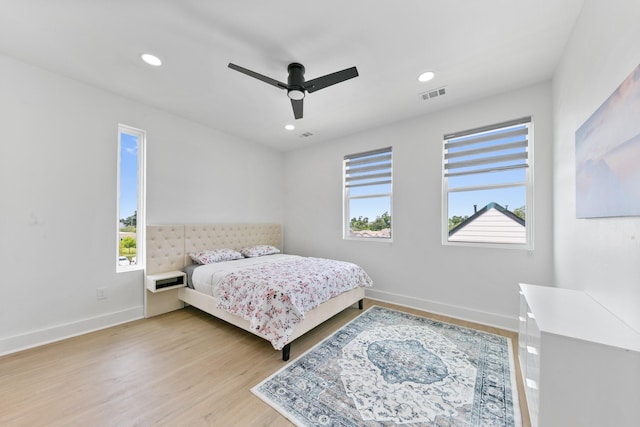 104 E 44th St Unit A, Houston, TX 77018 - bedroom featuring multiple windows, wood finished floors, recessed lighting, and ceiling fan