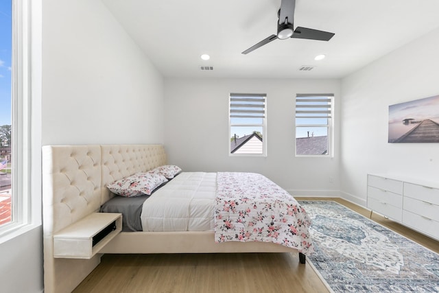 104 E 44th St Unit A, Houston, TX 77018 - bedroom with wood finished floors, ceiling fan, and recessed lighting