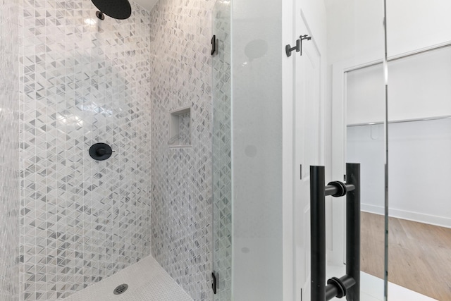 104 E 44th St Unit A, Houston, TX 77018 - full bathroom featuring a shower stall and wood finished floors