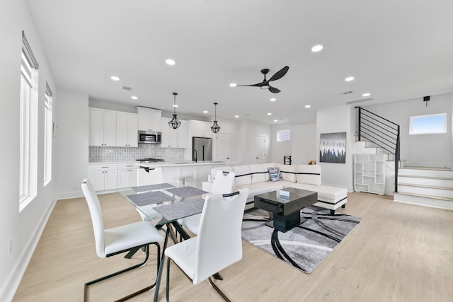 104 E 44th St Unit A, Houston, TX 77018 - dining area featuring light wood-style flooring, ceiling fan, recessed lighting, and stairway