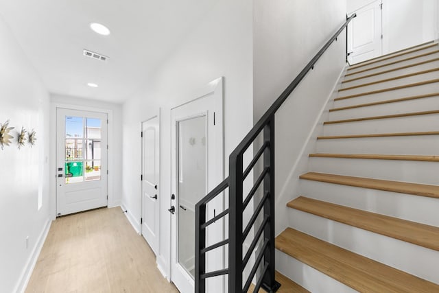 104 E 44th St Unit A, Houston, TX 77018 - foyer entrance with light wood-type flooring, stairway, and recessed lighting