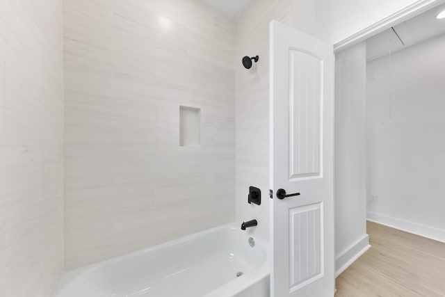 104 E 44th St Unit A, Houston, TX 77018 - bathroom featuring bathing tub / shower combination and wood finished floors