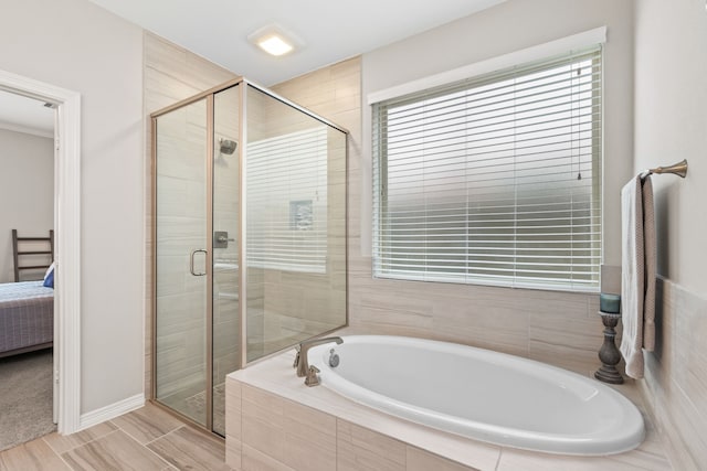 6303 Grand Drift Ct, Katy, TX 77494 - bathroom featuring a bath, ensuite bathroom, and a stall shower