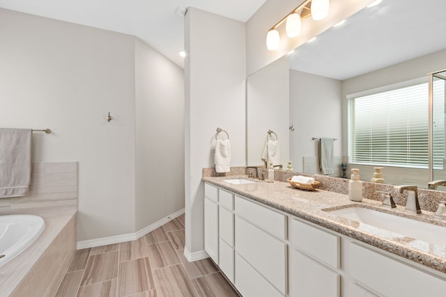 6303 Grand Drift Ct, Katy, TX 77494 - full bathroom with double vanity and a garden tub