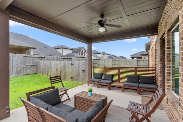 6303 Grand Drift Ct, Katy, TX 77494 - fenced backyard with an outdoor hangout area, a ceiling fan, and a patio