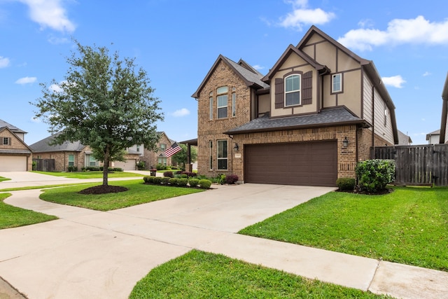 6303 Grand Drift Ct, Katy, TX 77494 - view of front facade with brick siding, driveway, a garage, and stucco siding