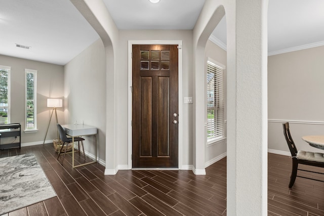 6303 Grand Drift Ct, Katy, TX 77494 - foyer entrance with arched walkways, plenty of natural light, dark wood finished floors, and ornamental molding