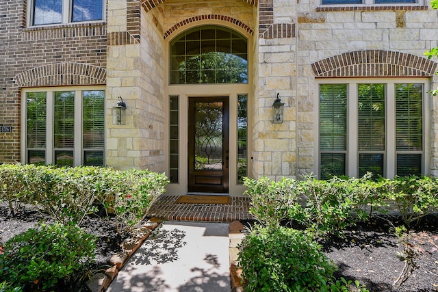 8706 Stowe Creek Ln, Missouri City, TX 77459 - view of exterior entry featuring stone siding and brick siding