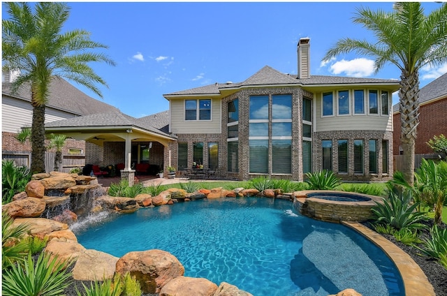 8706 Stowe Creek Ln, Missouri City, TX 77459 - view of pool featuring a pool with connected hot tub and a patio area