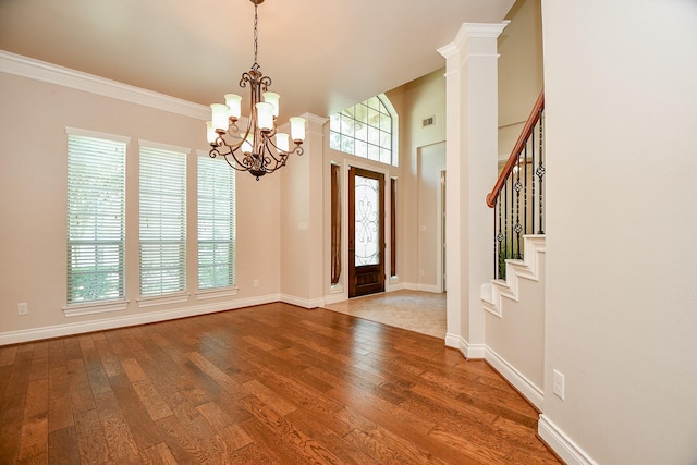 8706 Stowe Creek Ln, Missouri City, TX 77459 - entrance foyer featuring a chandelier, hardwood / wood-style floors, stairway, and crown molding