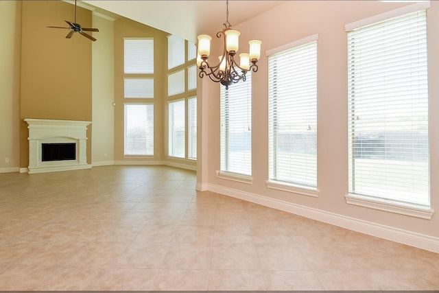 8706 Stowe Creek Ln, Missouri City, TX 77459 - unfurnished dining area featuring plenty of natural light, light tile patterned flooring, a chandelier, ceiling fan, and high vaulted ceiling