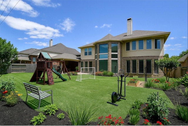 8706 Stowe Creek Ln, Missouri City, TX 77459 - back of house featuring a playground, brick siding, and a chimney