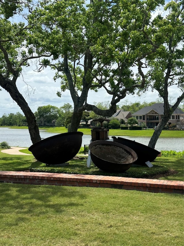 8706 Stowe Creek Ln, Missouri City, TX 77459 - view of home's community featuring a lawn and a water view