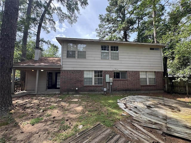 3 Ridgeline Ct, The Woodlands, TX 77381 - back of house featuring brick siding and a chimney