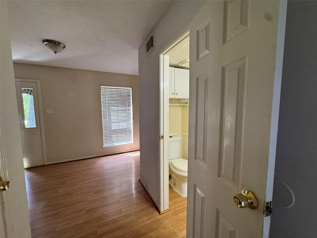 3 Ridgeline Ct, The Woodlands, TX 77381 - corridor with light wood-style flooring and baseboards