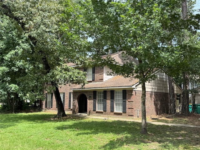 3 Ridgeline Ct, The Woodlands, TX 77381 - obstructed view of property with a front yard and brick siding