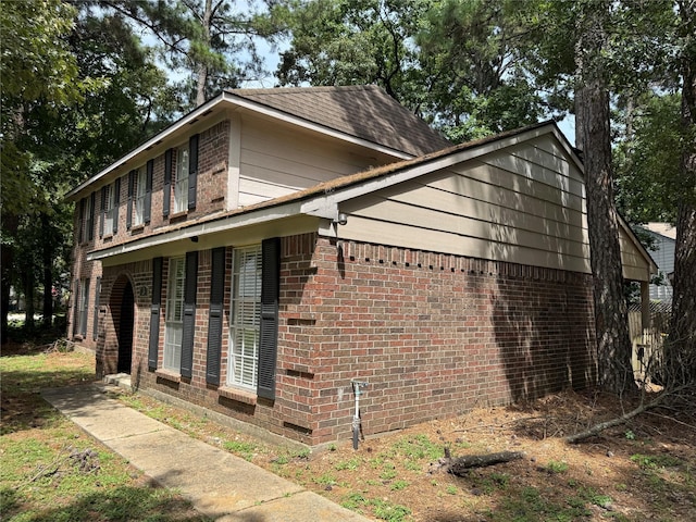 3 Ridgeline Ct, The Woodlands, TX 77381 - view of side of home featuring brick siding