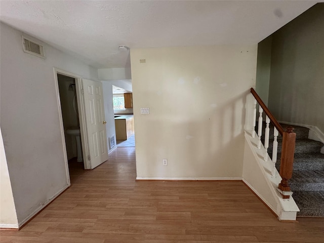 3 Ridgeline Ct, The Woodlands, TX 77381 - stairway featuring wood finished floors and baseboards