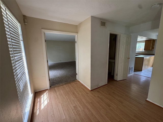 3 Ridgeline Ct, The Woodlands, TX 77381 - unfurnished room featuring light wood finished floors and a smoke detector