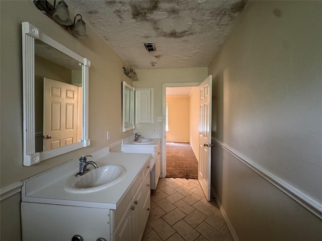 3 Ridgeline Ct, The Woodlands, TX 77381 - bathroom with vanity and a textured ceiling