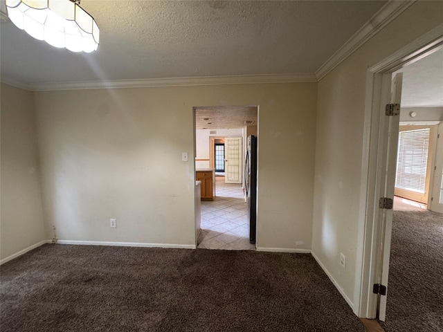 3 Ridgeline Ct, The Woodlands, TX 77381 - spare room featuring light carpet, ornamental molding, and a textured ceiling