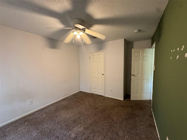 3 Ridgeline Ct, The Woodlands, TX 77381 - unfurnished bedroom featuring dark carpet, a textured ceiling, and ceiling fan