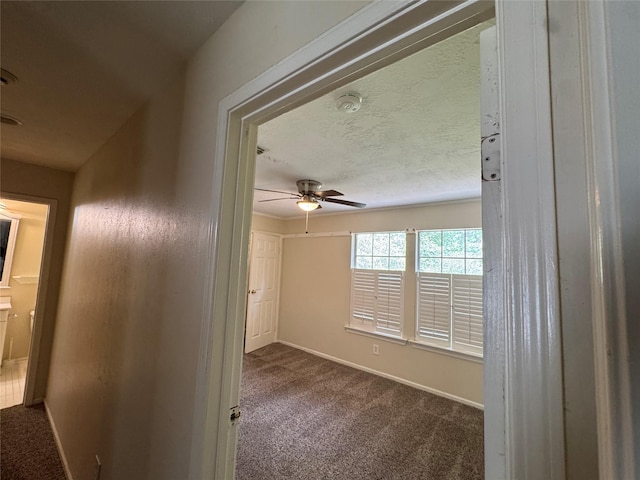 3 Ridgeline Ct, The Woodlands, TX 77381 - unfurnished room with dark colored carpet, a smoke detector, and a ceiling fan