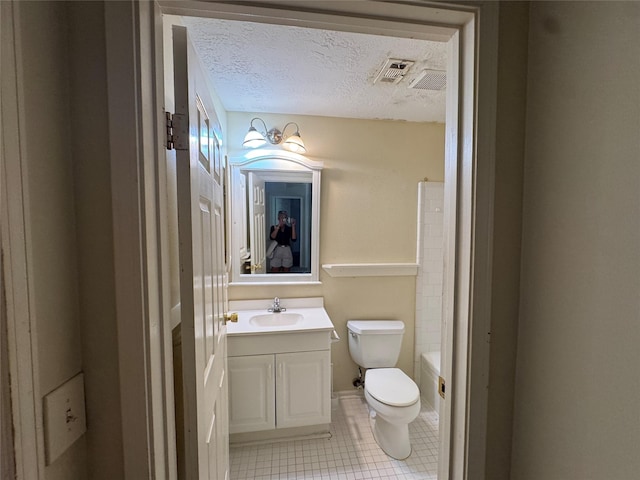 3 Ridgeline Ct, The Woodlands, TX 77381 - bathroom with vanity, a textured ceiling, and tile patterned floors