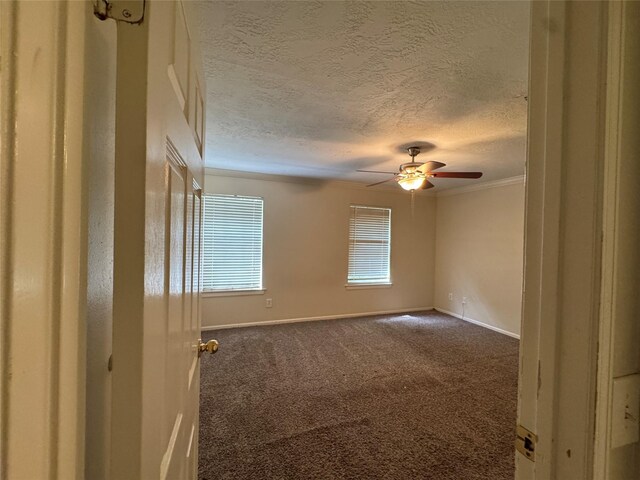 3 Ridgeline Ct, The Woodlands, TX 77381 - spare room with a textured ceiling, a ceiling fan, carpet flooring, and ornamental molding