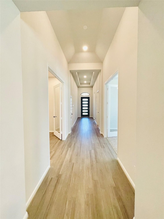 669 Cape Capri Dr, Katy, TX 77493 - hall with light wood-style floors, attic access, and lofted ceiling