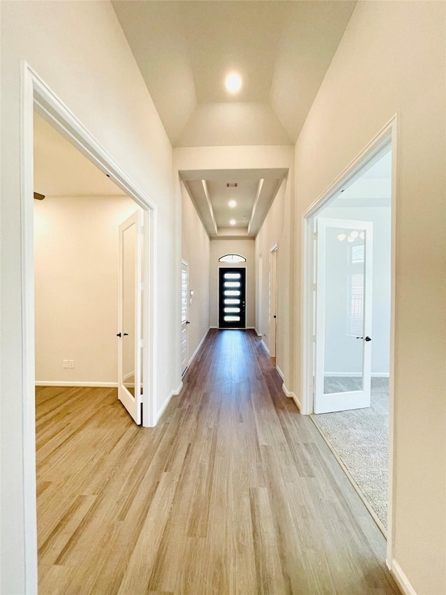 669 Cape Capri Dr, Katy, TX 77493 - hallway featuring wood finished floors and french doors