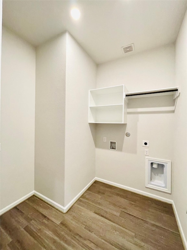 669 Cape Capri Dr, Katy, TX 77493 - laundry area with hookup for an electric dryer, gas dryer hookup, wood finished floors, hookup for a washing machine, and recessed lighting