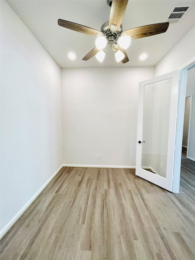 669 Cape Capri Dr, Katy, TX 77493 - spare room featuring wood finished floors, a ceiling fan, and recessed lighting