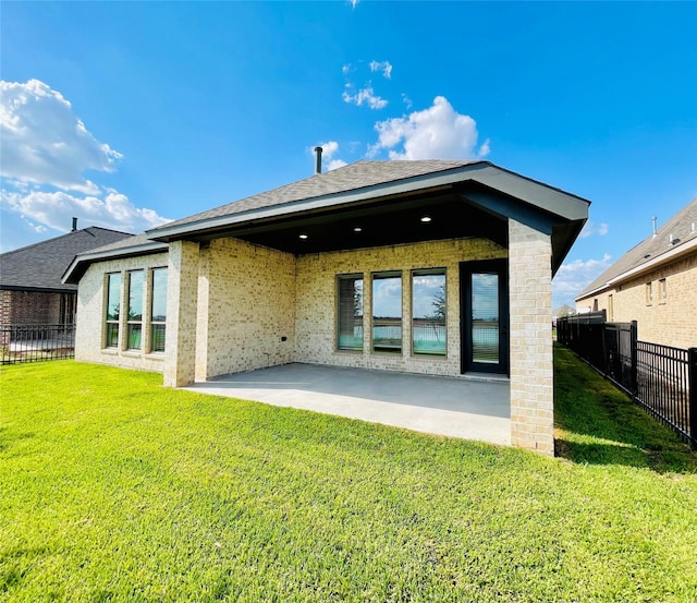 669 Cape Capri Dr, Katy, TX 77493 - back of house with a patio, brick siding, and a shingled roof