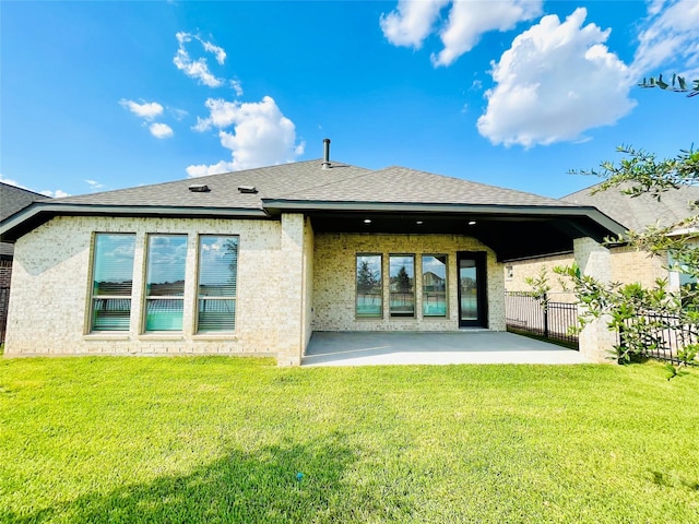 669 Cape Capri Dr, Katy, TX 77493 - rear view of property with a patio, a shingled roof, and brick siding