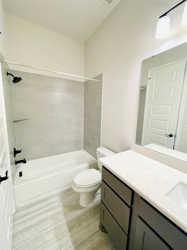 669 Cape Capri Dr, Katy, TX 77493 - bathroom with vanity,  shower combination, wood finished floors, and a textured wall