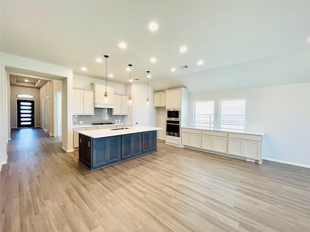 669 Cape Capri Dr, Katy, TX 77493 - kitchen featuring built in microwave, oven, light wood-style floors, light countertops, and white cabinets