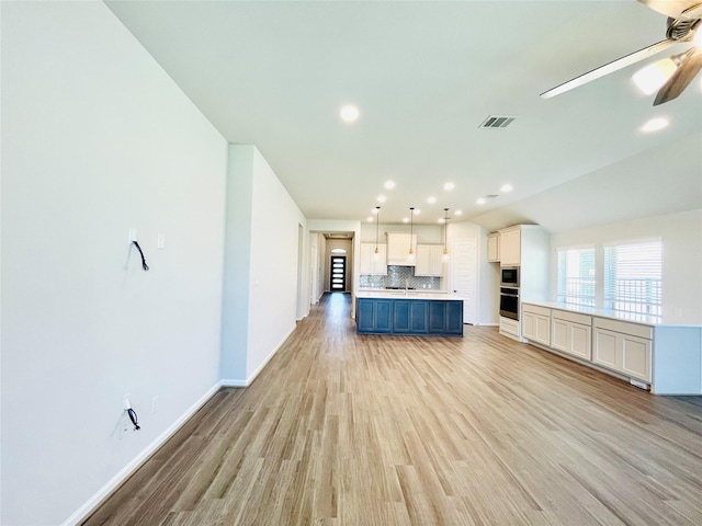669 Cape Capri Dr, Katy, TX 77493 - unfurnished living room with ceiling fan, light wood-style flooring, and recessed lighting