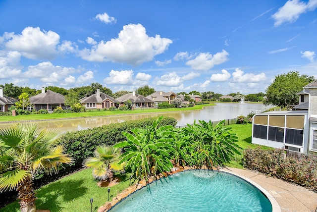 1006 Pointe Loma Dr, Sugar Land, TX 77479 - view of swimming pool with a residential view and a water view
