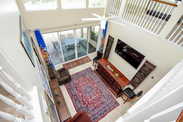1006 Pointe Loma Dr, Sugar Land, TX 77479 - living area with a high ceiling, plenty of natural light, and ceiling fan