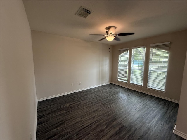 2325 Shady Tree Ln, Conroe, TX 77301 - empty room with dark wood-style floors and a ceiling fan